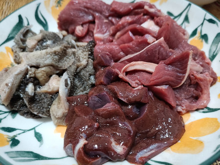 Slices of raw beef on a plate, close-upの写真素材