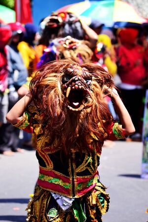 Ambarawa, Central Java/Indonesia - August 17, 2017 : Man in Mask, Indonesian citizens celebrate Independence Day with a variety of activities such as Indonesian cultural carnival along the Kartini-Tambakboyo roadのeditorial素材