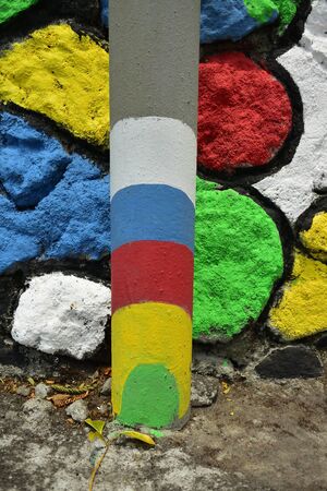 Background, colorful stone walls with a combination of red, white, green, yellow, blue  and other colorsの写真素材