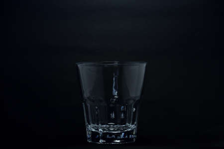 A 100 ml transparent glass on a black backgroundの写真素材