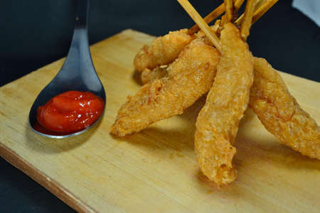 Satay Egg Roll is one of Indonesian food. It made from eggs fried in hot oil then rolled with sticksの写真素材