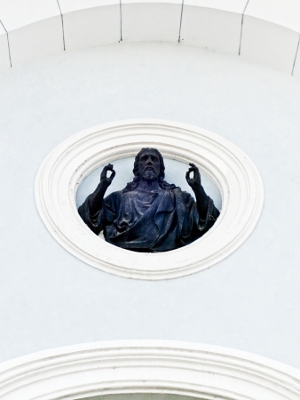 The sculpture Jesus Christ is located on facade wall of the Transfiguration Cathedral  Sumy, Ukraine の写真素材