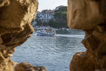Looking trough a small cave out on the Skiathos bay, Greeceの写真素材