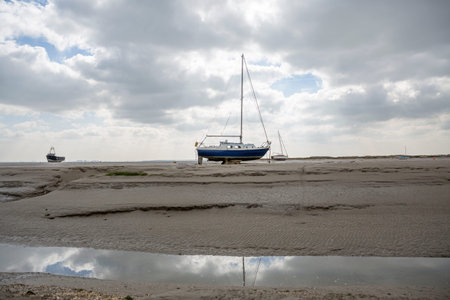 Fisherman boats stuck on the beach in low tide period in Leigh-on-Sea, UK.