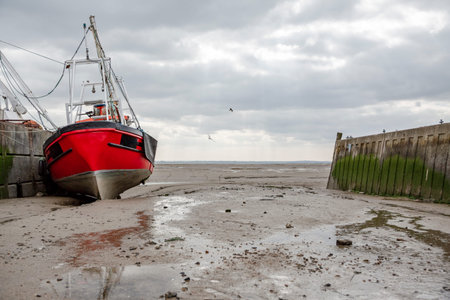 Fisherman boats stuck on the beach in low tide period in Leigh-on-Sea, UK.