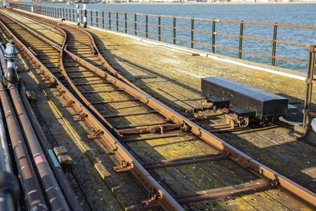 Southend Pier Railway. Two railway tracks merge together near water, Southend-on-Sea, UK.の写真素材