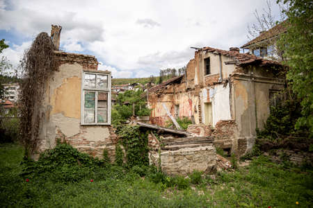 Destroyed and abandoned old house in Bulgarian village.の写真素材