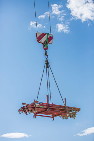 Industrial area. Unloading by the crane of the production equipmentin Graz, Austria.