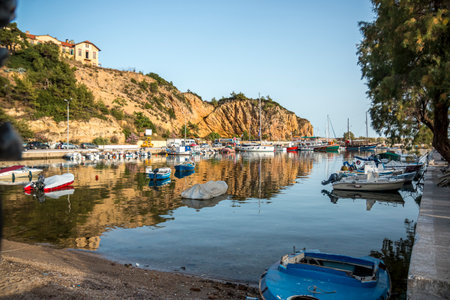 Small boats docked on the marina park with oceanfront view.の写真素材