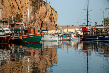 Small boats docked on the marina park with oceanfront view.の写真素材