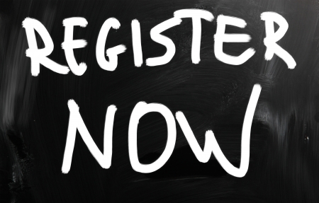 "Register now" handwritten with white chalk on a blackboardの写真素材