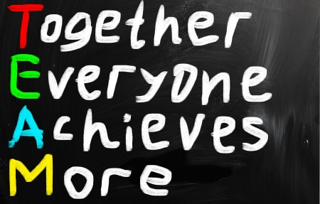 Team acronym white chalk handwriting on blackboardの写真素材