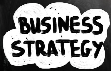 Business ideas handwritten with white chalk on a blackboard.の写真素材