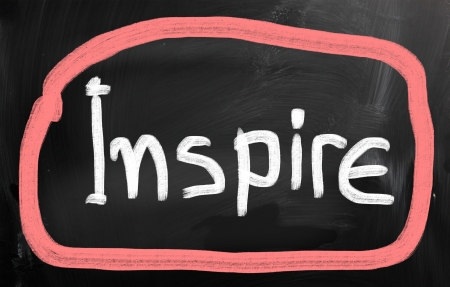 Inspire handwritten with chalk on a blackboardの写真素材