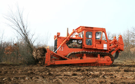 View of orange bulldozer at work