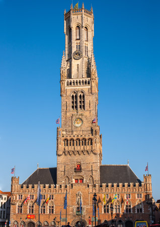 Bruges, Belgium - July 11, 2010 : the Belfry of Bruges, medieval bell tower overlooking a market squareのeditorial素材