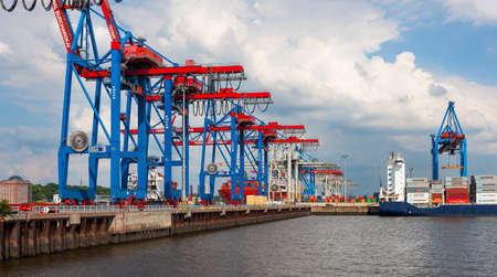 Hamburg, Germany - July 12, 2011 : Docks at Hamburg Harbor. Cargo and shipping industry on south shore of Elbe River.のeditorial素材