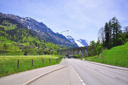 viaduct and road in Alps, Switzerlandの写真素材