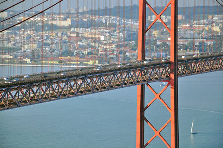 Road traffic on the bridge of 25th April in Lisbon, Portugal