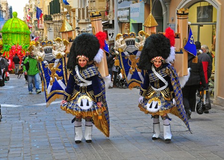 VALLETTA, MALTA - MARCH 1: Spring carnival on street of Valletta downtown on march 1, 2014. Maltese carnival holds from february 27 till march 3, 2014.のeditorial素材