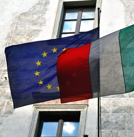 Flags of Italy and European Union on the buildingの写真素材