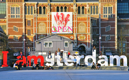 AMSTERDAM, NETHERLANDS - MARCH 26: Tourists at the famous sign "I amsterdam" at the Rijksmuseum in Amsterdam on March 26, 2012. Amsterdam is a capital and largest city of Netherlands.のeditorial素材