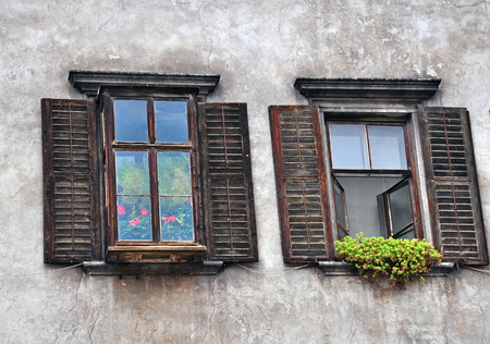 Wooden windows with shuttersの写真素材