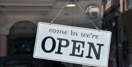 Hanging open sign in the shopの写真素材
