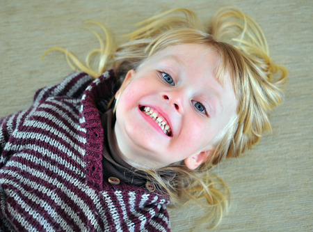 Cute baby with a long hairの写真素材