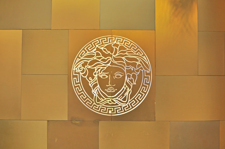 HO CHI MINH, VIETNAM - MARCH 7: Logo of Versace flagship store in Ho Chi Minh city centre on March 7, 2015. Versace is a world famous fashion brand founded in Italy.のeditorial素材