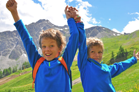 Two smiling boys in mountains, Italyの写真素材
