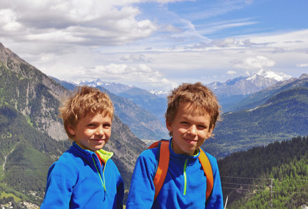 Two smiling boys in mountains, Italyの写真素材