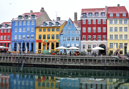 COPENHAGEN, DENMARK - MARCH 13: Multicolor houses in Nyhavn street on March 13, 2013. Nyhavn is the most famous street in the capital of Denmark.のeditorial素材