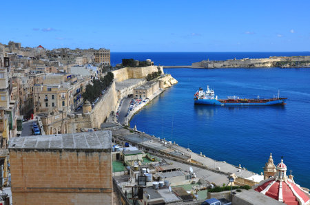 VALLETTA, MALTA - FEBRUARY 24, 2014: View of the seafront in the harbor of Valletta on February 24, 2014. Valletta is a capital and the largest city of Malta.のeditorial素材