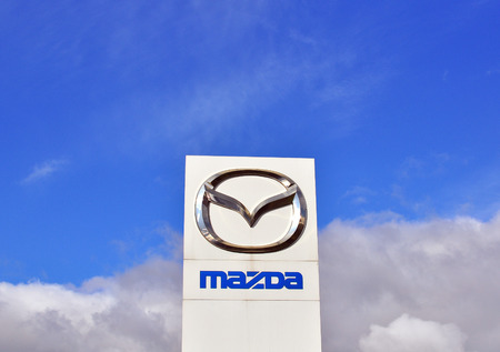 MOSCOW, RUSSIA - OCTOBER 10, 2015: Logotype of Mazda corporation on October 10, 2015. Mazda is the Japanese automotive manufacturer.のeditorial素材