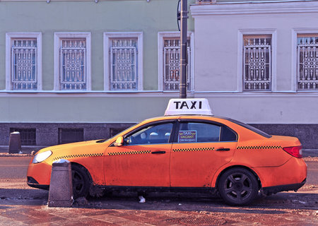 MOSCOW, RUSSIA - JANUARY 11: Taxi car in the street of city centre of Moscow on January 11, 2016.のeditorial素材