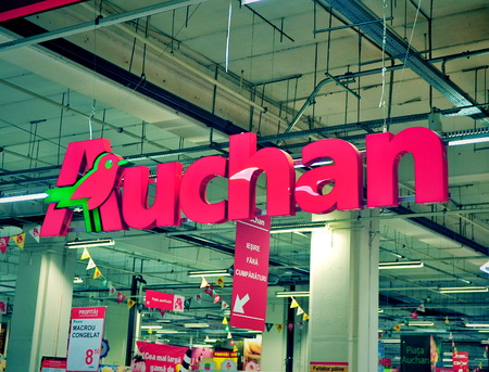 TIMISOARA, ROMANIA - MAY 2: Logotype of Auchan hypermarket on May 2, 2016. Auchan is a global food stores chain founded in France.のeditorial素材