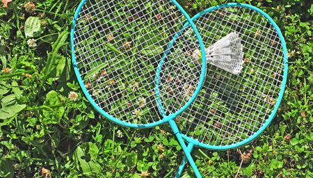 Badminton rackets in the grassの写真素材