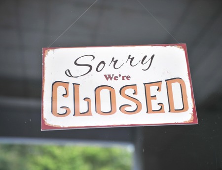 Sorry we are closed sign on the windowの写真素材
