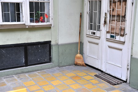 Mop at the door in the country houseの写真素材