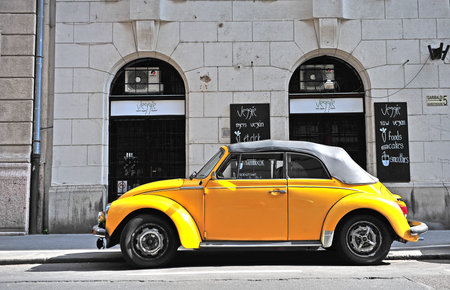 BUDAPEST, HUNGARY - MAY 29: Yellow retro Volkswagen beetle car in in street of Budapest on May 29,...