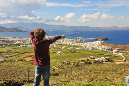 Little traveller standing at the top on Naxos island, Greece