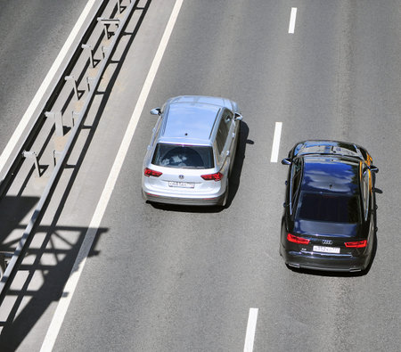 MOSCOW, RUSSIA - JUNE 20: Top view of two cars in highway, Moscow on June 20, 2018.