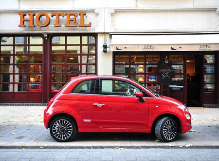 BUDAPEST, HUNGARY - 21 SEPTEMBER: Deep red Fiat 500 car the street of Budapest on September 21, 2018.のeditorial素材