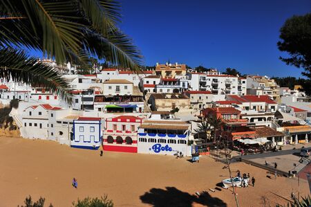 CARVOEIRO, PORTUGAL - MARCH 3: White houses on the beach of Carvoeiro village, Portugal on March 3, 2019.のeditorial素材