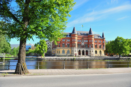 Orebro, Sweden - June 23, 2019: View of historical building by the river in city centre of Orebro, Sweden.のeditorial素材