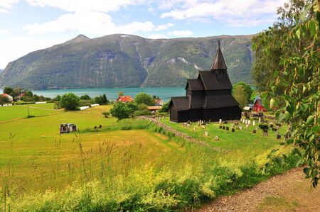 Amazing landscape with old stave church on fjords, Norway on summerの写真素材