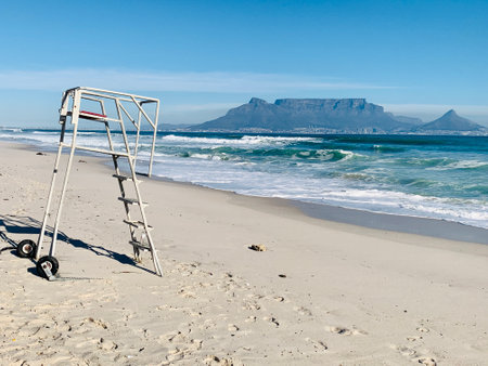 Empty lifeguard tower on sandy beach in Cape Town, South Africaの写真素材