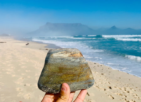 Stone in hand on the beach, Fuerteventura, Canary Islands, Spainの写真素材