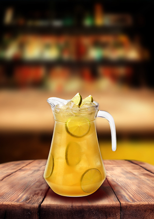 Lemonade bar pub yellow lemon drink wooden table, with blurred backgroundの写真素材